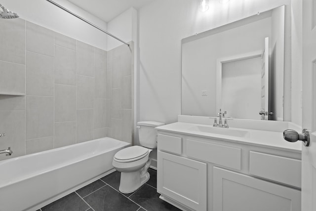 full bathroom featuring tile patterned floors, vanity, toilet, and tiled shower / bath