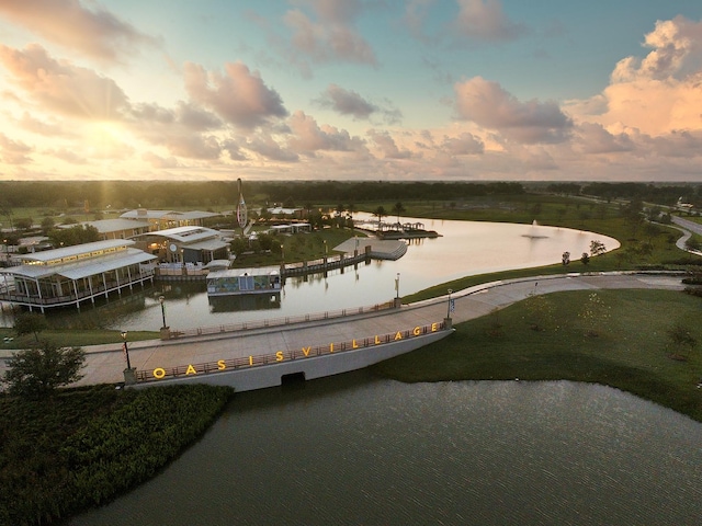 aerial view at dusk with a water view