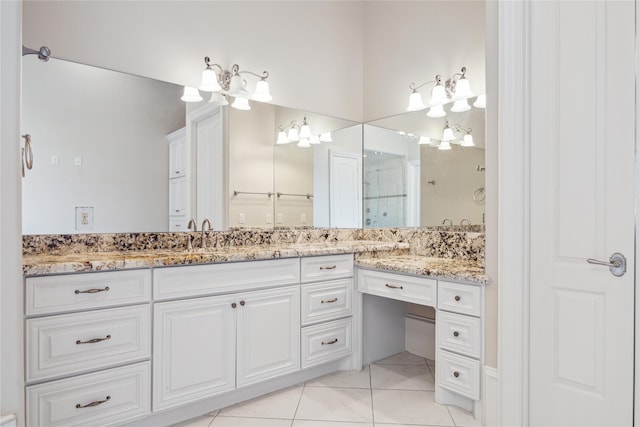 bathroom featuring walk in shower, tile patterned floors, and vanity