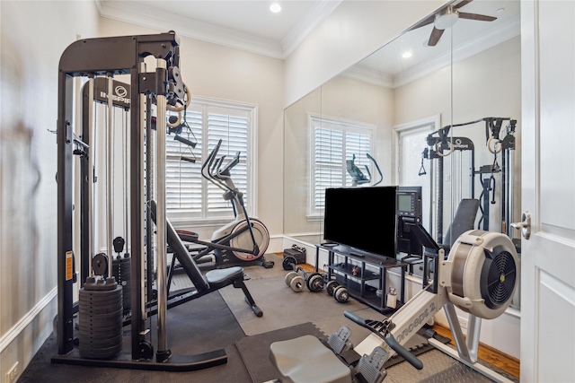 workout area with ceiling fan and crown molding