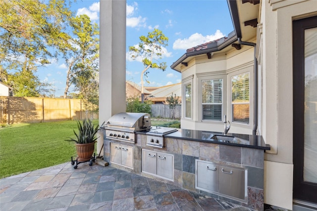 view of patio / terrace with sink and area for grilling