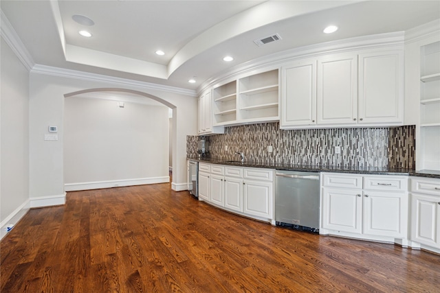 kitchen featuring white cabinetry, stainless steel dishwasher, and dark hardwood / wood-style floors