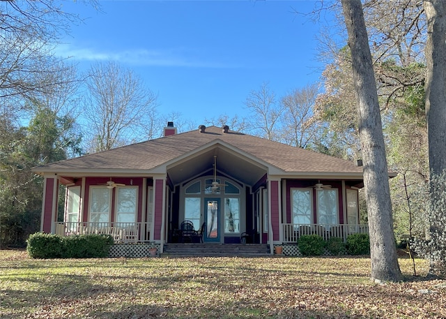 112 Lcr 799a, Groesbeck, TX 76642 - view of front facade featuring covered porch, a ceiling fan, and a shingled roof