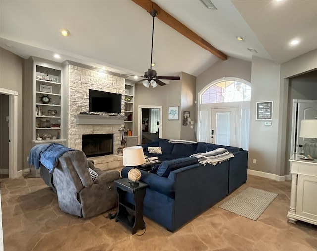 living room with built in shelves, lofted ceiling with beams, a stone fireplace, and ceiling fan