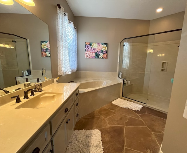 bathroom featuring vanity and shower with separate bathtub