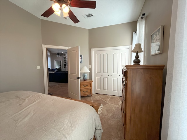 bedroom with light colored carpet, a closet, and ceiling fan