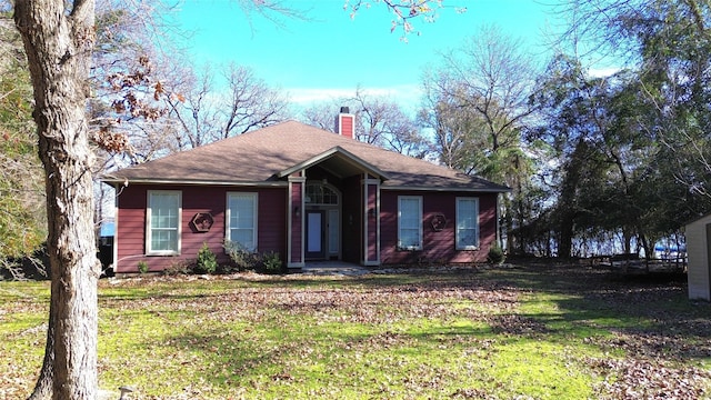 112 Lcr 799a, Groesbeck, TX 76642 - ranch-style house with a chimney, a front lawn, and a shingled roof