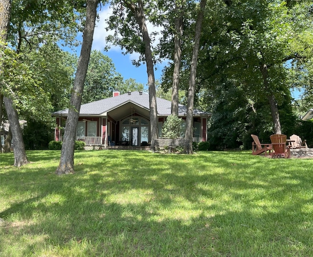 112 Lcr 799a, Groesbeck, TX 76642 - view of front of house with a front lawn and a chimney