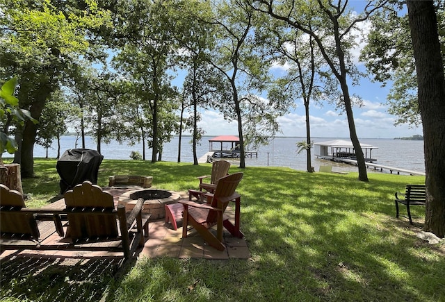 112 Lcr 799a, Groesbeck, TX 76642 - view of grassy yard with an outdoor fire pit, a water view, and a dock