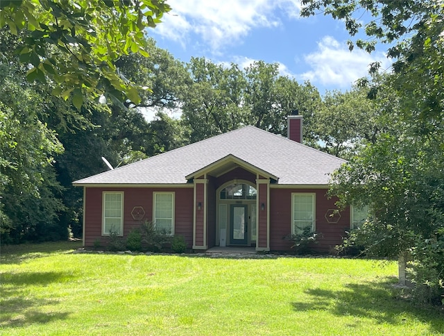 112 Lcr 799a, Groesbeck, TX 76642 - ranch-style house featuring a front lawn, a chimney, and a shingled roof