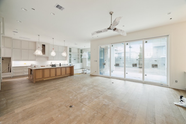 unfurnished living room featuring light hardwood / wood-style flooring