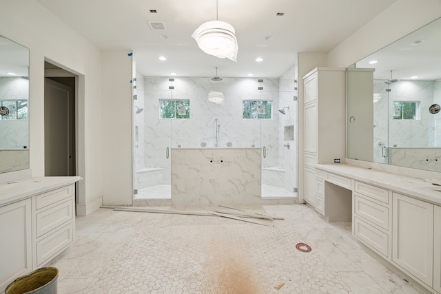 bathroom featuring walk in shower and vanity