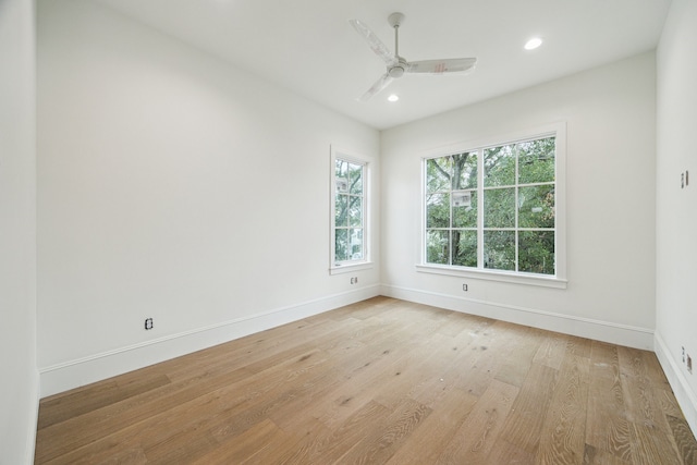 spare room featuring ceiling fan and light wood-type flooring