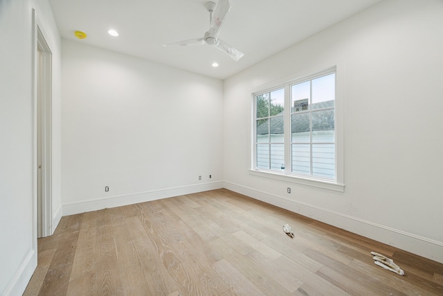 unfurnished room with ceiling fan and light hardwood / wood-style floors