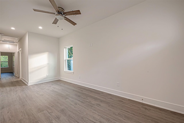 spare room featuring hardwood / wood-style flooring and ceiling fan