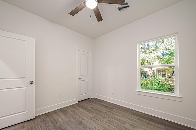 empty room with ceiling fan and wood-type flooring