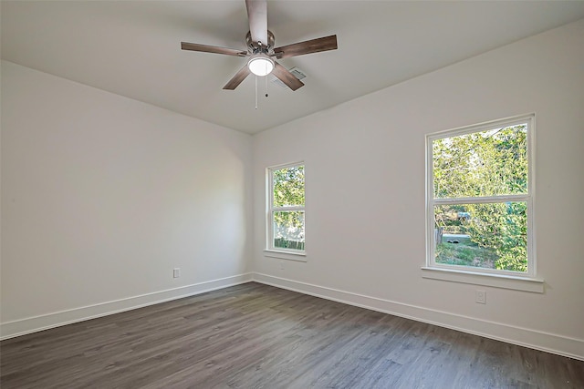 unfurnished room with ceiling fan and dark wood-type flooring