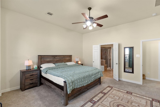 bedroom with ceiling fan and light carpet