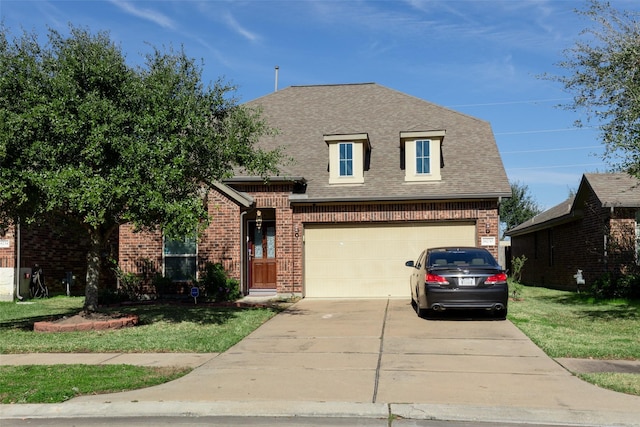 view of front of home with a garage and a front yard