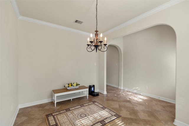 dining room with tile patterned flooring, crown molding, and a chandelier