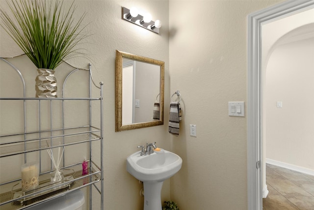 bathroom with tile patterned flooring and sink