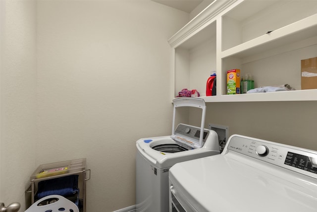 clothes washing area with independent washer and dryer