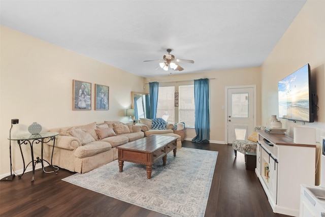 living room with ceiling fan and dark hardwood / wood-style flooring