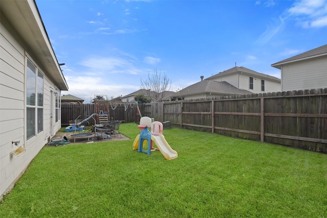 view of yard with a fire pit