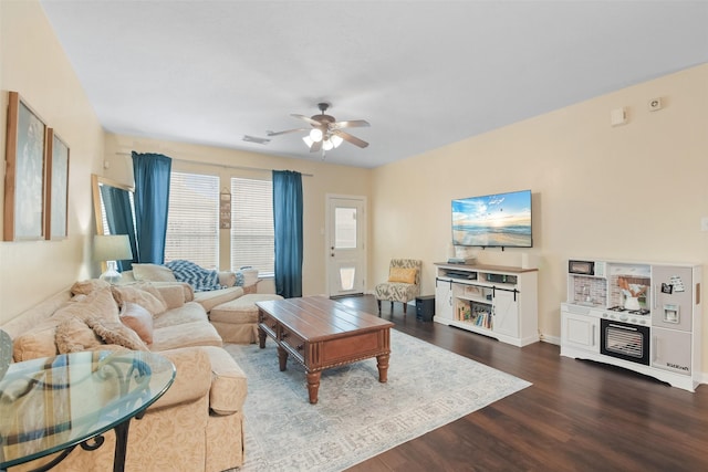 living room featuring hardwood / wood-style floors and ceiling fan