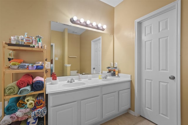 bathroom with tile patterned floors and vanity