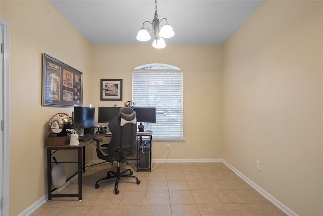 tiled home office with an inviting chandelier