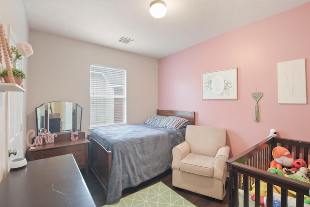 bedroom featuring dark hardwood / wood-style floors