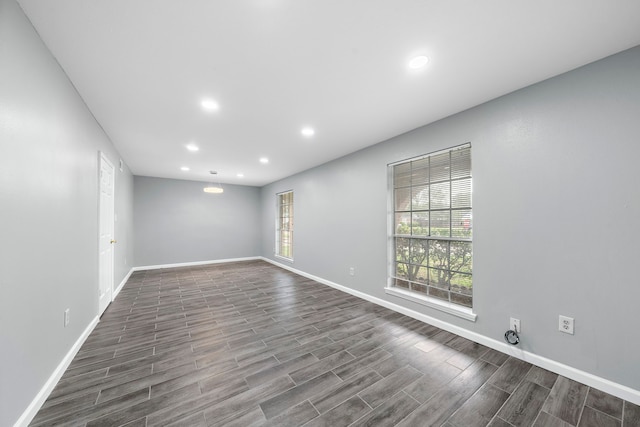 unfurnished room with wood-type flooring