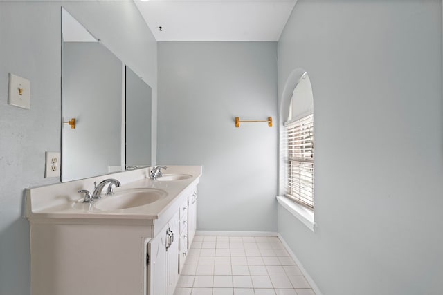 bathroom with tile patterned flooring and vanity