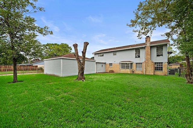 rear view of house with a lawn