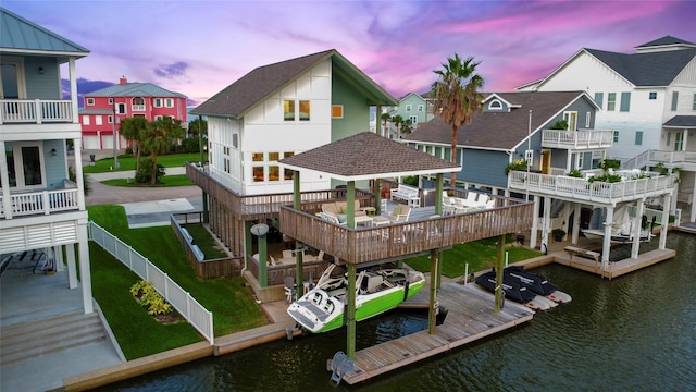 22823 Chiquita St, Galveston, TX 77554 - dock area featuring a fenced backyard, a residential view, and a water view