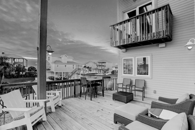 wooden deck with an outdoor living space and a residential view