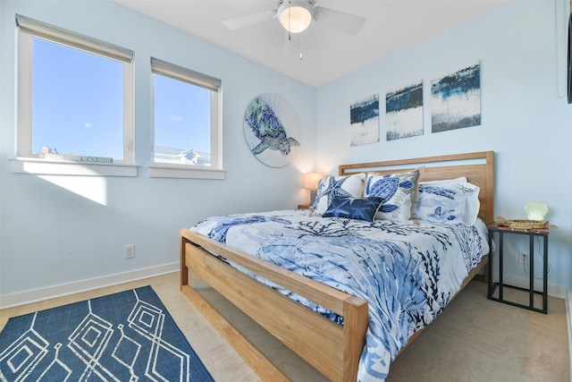 bedroom featuring baseboards and ceiling fan