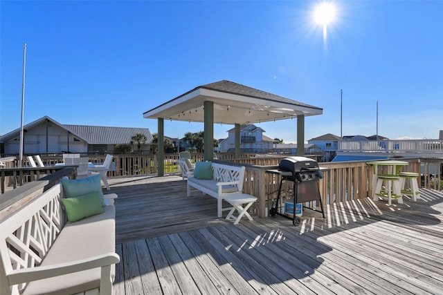 22823 Chiquita St, Galveston, TX 77554 - wooden terrace featuring grilling area and a residential view