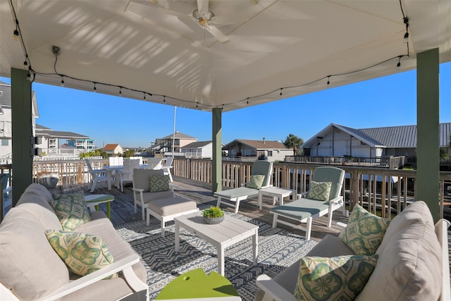 view of patio featuring a gazebo, a residential view, an outdoor hangout area, and a ceiling fan