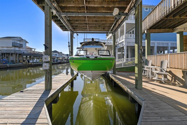 22823 Chiquita St, Galveston, TX 77554 - view of dock featuring boat lift and a water view