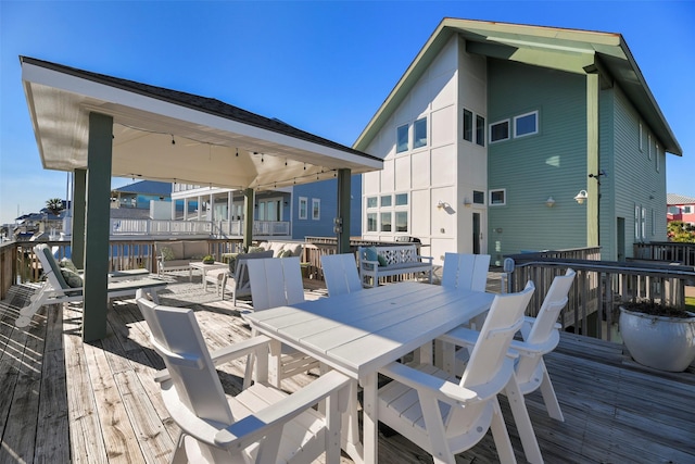 deck featuring outdoor dining area