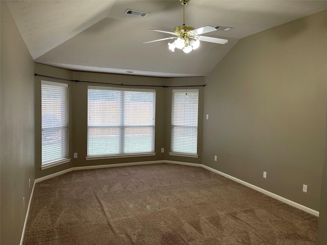 spare room featuring ceiling fan, carpet, and vaulted ceiling