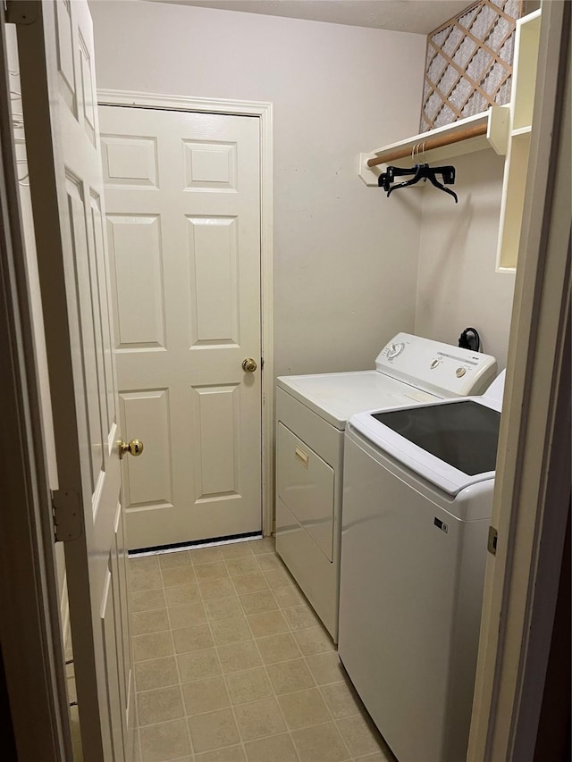 laundry area with washing machine and dryer