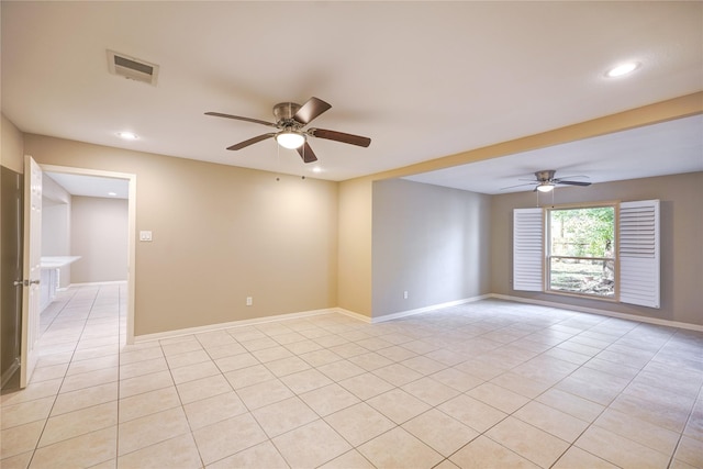 tiled empty room with ceiling fan