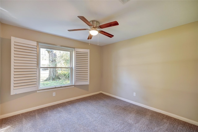 spare room with carpet floors and ceiling fan