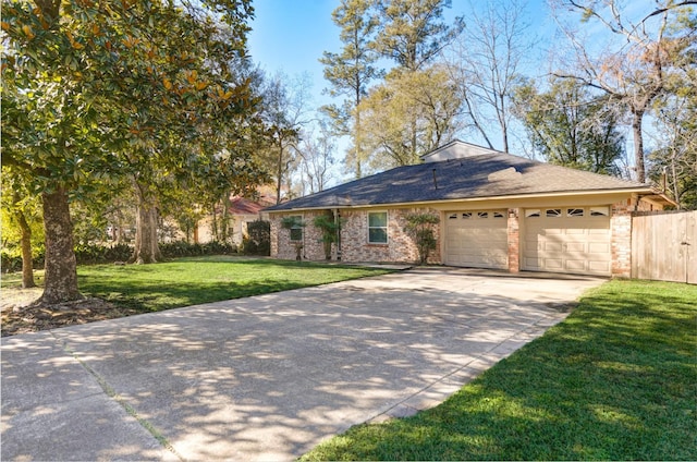 view of front of house featuring a front lawn and a garage