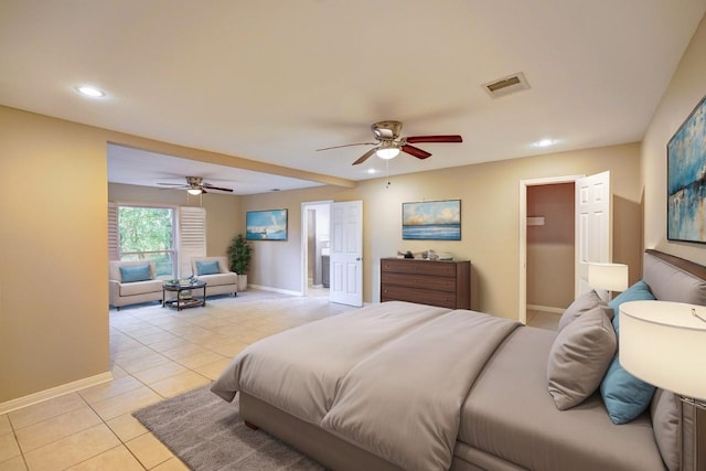 tiled bedroom featuring ceiling fan