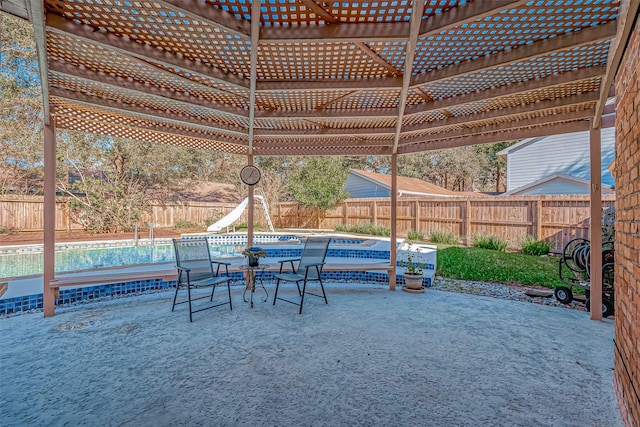 view of patio / terrace with a fenced in pool