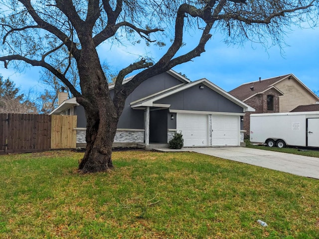 ranch-style home with a garage and a front lawn